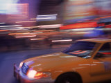 Buy Blurred View of Taxi Cab in Times Square, NYC at AllPosters.com