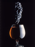 Bunch of Grapes Over a Glass of Wine