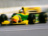 Yellow Race Car in Motion Photographic Print
