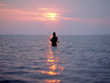 Man Fishing in Middle of the Water
