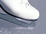 Close-up of Figure Skate on Ice