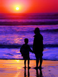 Buy Sunset Silhouette of Mom and Boy Along Coast at AllPosters.com