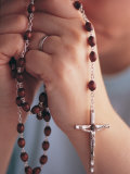 Woman Praying with Rosary Beads