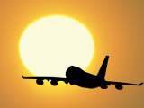 Silhouette of Airplane with Sun