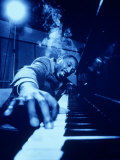 Man Running His Fingers Over a Piano