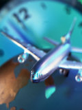 Buy Model Jet Over Glass Globe with Clock Behind at AllPosters.com