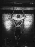 Rear View of Muscular Man Holding Chains Photographic Print