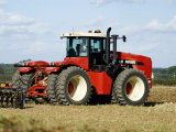 4 Wheel Drive Tractor Pulling a Disc Harrow, Cotswolds, England