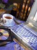 Laptop Computer, Cd-Rom, Cup of Tea, and Books