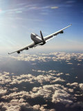 Buy Airplane Flying Through Clouds at AllPosters.com