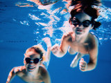 Buy Boy and Girl Wearing Goggles Underwater at AllPosters.com