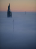 Buy Morning Fog Obscures All But the Top of a High Rise in Montevideo at AllPosters.com