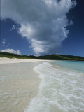 A Strip of Cumulous Clouds Follows This Receding, Tropical Shoreline
