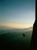 A Rock Climber from the 90 Degree Face of a Mountain Wall