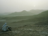 A Man Stares out at the Desert Landscape
