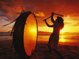 Native Hawaiian Man Beats His Drum on Makena Beach at Sunset
