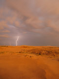 A Bolt of Lightning Strikes the Sand Dune Landscape