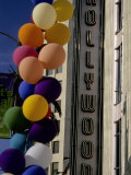 Multi-Colored Balloons and a Neon Sign Welcome Visitors to Hollywood