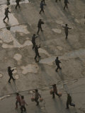 Buy An Exercise Group Does Tai-Chi While Pedestrians Pass By at AllPosters.com