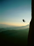 A Rock Climber from the 90 Degree Face of a Mountain Wall