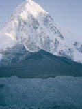 Buy Mount Pumori Seen Behind the Darker Kala Pattar Mountain in the Foreground at AllPosters.com