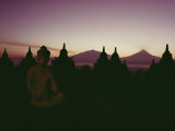 Buy A Buddha Sits in the Silence Amid 1200-Year-Old Stupas at Borobudur at AllPosters.com