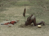 Buy A Sadhu, or Holy Man, Buries His Head in a Feat of Breath Control Demonstrating His Mastery of Yoga at AllPosters.com