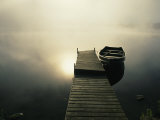 Buy The Morning Sun Shines on a Rowboat Tied to a Dock at AllPosters.com