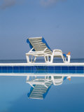 Buy A Deck Chair Offers Poolside Relaxation to a Vacationer at AllPosters.com