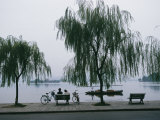 Bicyclists Enjoy the View in a Hangzhou Lakeside Park
