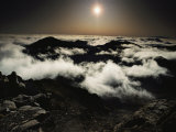 Buy Softened by Haze, the Rising Sun Glows over Patchy Clouds Which Partially Obscure the Crater at AllPosters.com