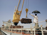 Unloading Freight from a Ship Docked in Khulna