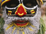 A Tribesman in Ceremonial Attire Glowers During a Festival