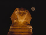 A View of the Great Sphinx at Night, Lit by a Light Show and Backed by a Full Moon