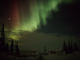 The Aurora Borealis Streaks Down Across the Night Sky