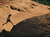 Buy A Woman Hikes on Red Rocks in Northern Arizona at AllPosters.com