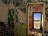 A Doorway Leads to Another Doorway in the Interior of an Abandoned Building