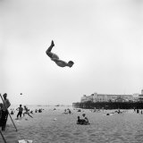 Man Flying Off a Trampoline at Santa Monica Beach