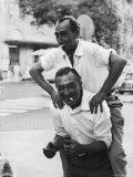 Buy Italian Man Leaping Onto a Friend's Back in Casual Greeting While Crossing a Piazza at AllPosters.com