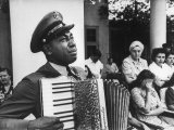 Navy CPO Graham Jackson Playing Accordian, Crying as Franklin D Roosevelt's Body is Carried Away