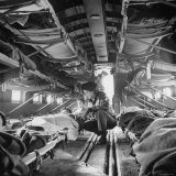 Buy American "Flying Nurse", Julia Corinne Riley, Checks on Patients Aboard C-47 Transport Plane at AllPosters.com