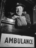 Buy Ambulance Driver Knitting For the English Army During WWII at AllPosters.com