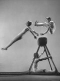 Danish Gymnasts Erik Hansen Followed by John Thomsen Do High Thief Jump as Team Member Braces Buck