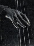Hand of Bass Player on the Strings During Jam Session at Photographer Gjon Mili's Studio