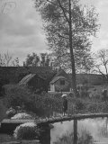 Little Boy Crossing the Bridge over the Stream at Winson Mill Farm, A War Nursery