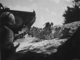 First Wave of Marines on Saipan Beach Waiting For Support During Invasion of Marianas Islands