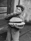 Buy Little Boy Holding Loaves of Bread at AllPosters.com