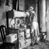 Buy Woman Cooking on Old Fashioned Stove at AllPosters.com