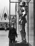 Little Boy Staring Up at Medieval Suit of Armor in the Metropolitan Museum of Art