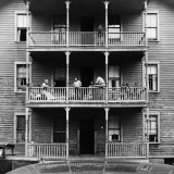 Buy Family on Balcony of Apartment Building at AllPosters.com